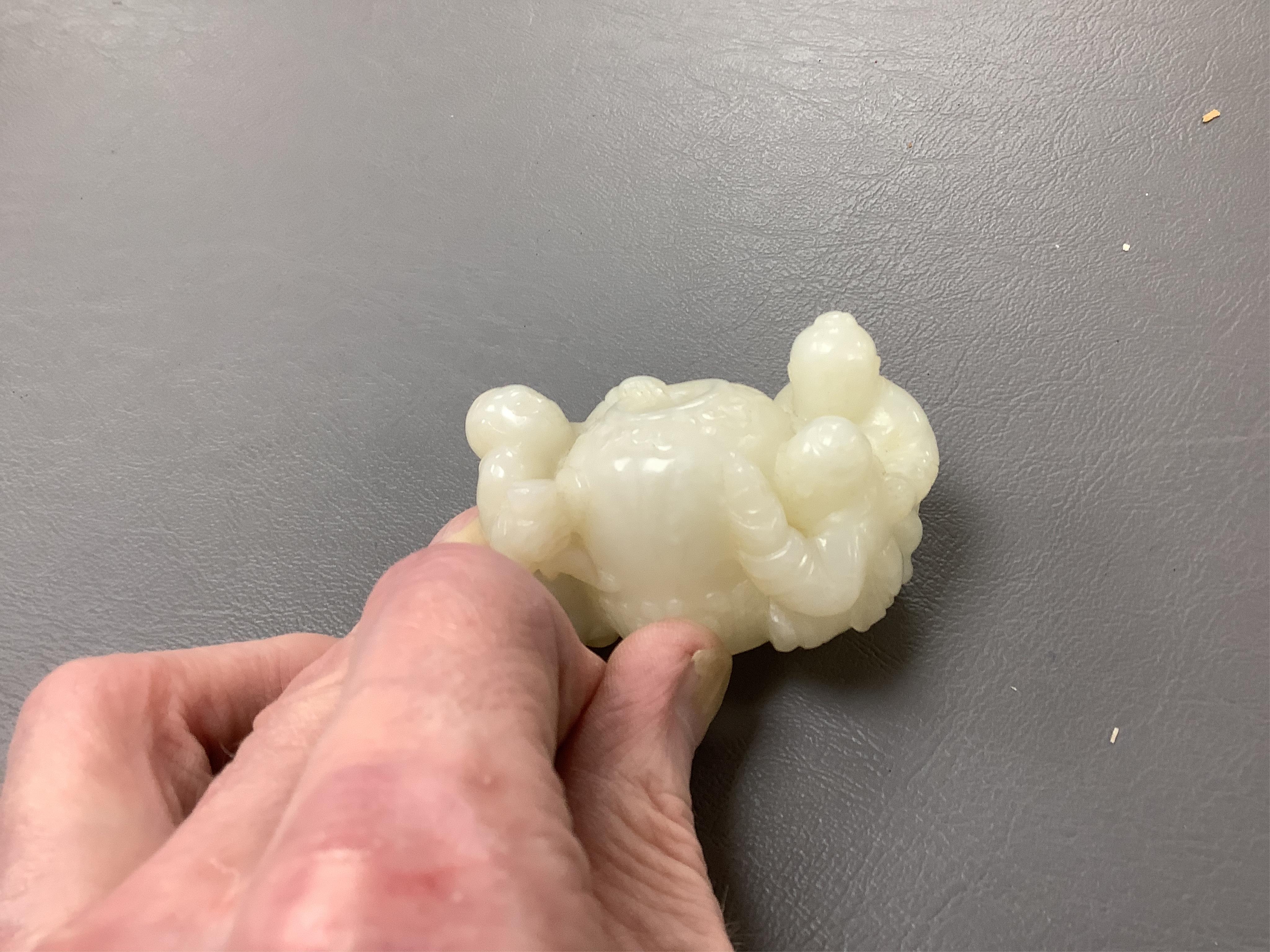 A Chinese white jade 'boys with jar' carving and three shoushan stone figures; luohan, girl with squirrel and mermaid (4), tallest 11cm